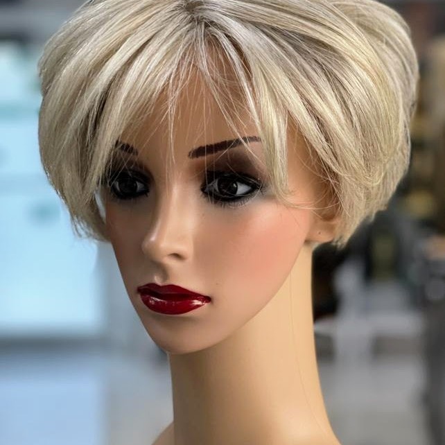 Topper that matched the client's natural hair (color, texture, density) and blended seemlessly